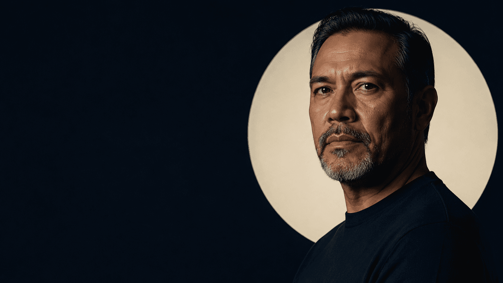 A veteran in civilian life, photographed in a sculptural cream and navy setting